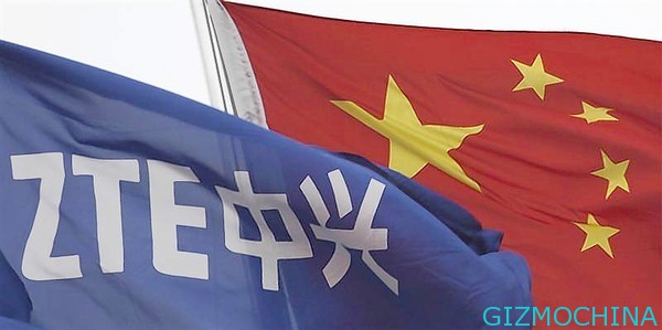 A ZTE flag flutters in front of the Chinese national flag outside its headquarters in Shenzhen, Guangdong province