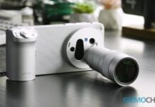 Best Vivo phones in 2026 Vivo X300 Ultra smartphone attached to a large professional camera lens on a desk.