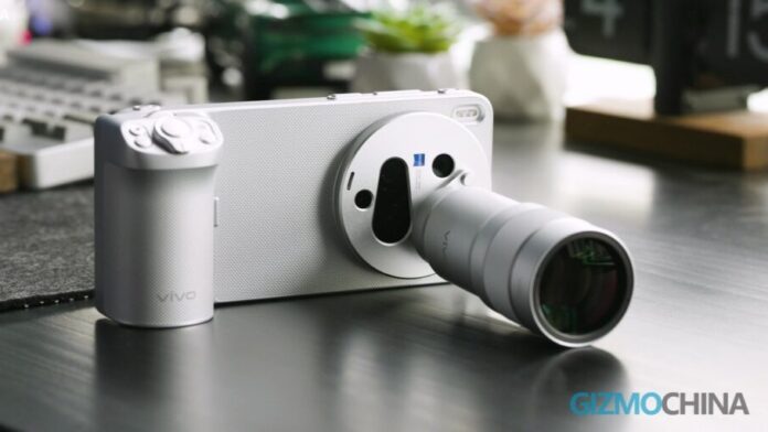Vivo X300 Ultra smartphone attached to a large professional camera lens on a desk.