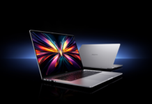 REDMI Book 16 2027 Geekbench listing hints at a more efficient chipset Two silver REDMI Book 16 laptops displayed against a dark background with blue lighting.