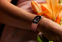 Google Fitbit Edge launches with a display, ECG, and up to seven days of battery life A person wears a pink Google Fitbit Edge fitness tracker on their wrist.