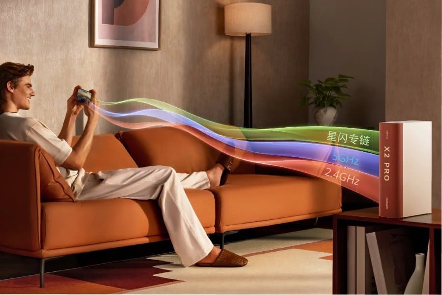 A person plays mobile games while connected to a Huawei Router X2 Pro device.