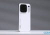 Oppo launches Find X10 and Find X10 Pro Max globally, but with smaller batteries The white Oppo Find X10 Pro Max smartphone stands upright against a grey background.