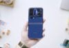 Xiaomi 18 Pro Max Review: Great Phone, but at what cost? A hand holds a blue Xiaomi 18 Pro Max smartphone with a camera island.