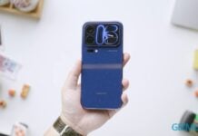 Xiaomi 18 Pro Max Review: Great Phone, but at what cost? A hand holds a blue Xiaomi 18 Pro Max smartphone with a camera island.