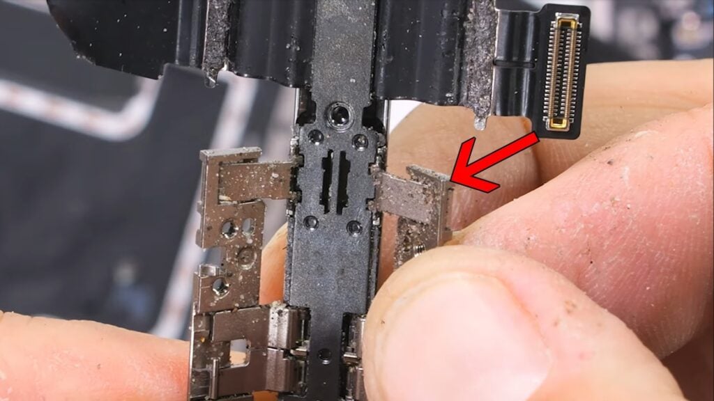 A closeup of the hinge component that could be pressing against the display from behind.