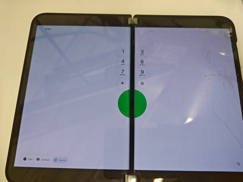 Microsoft Surface Duo 2's hinge blocks the middle column of iOS 26 Phone keypad